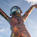 A 22-foot spaceman sculpture has landed in the Caribbean Sea